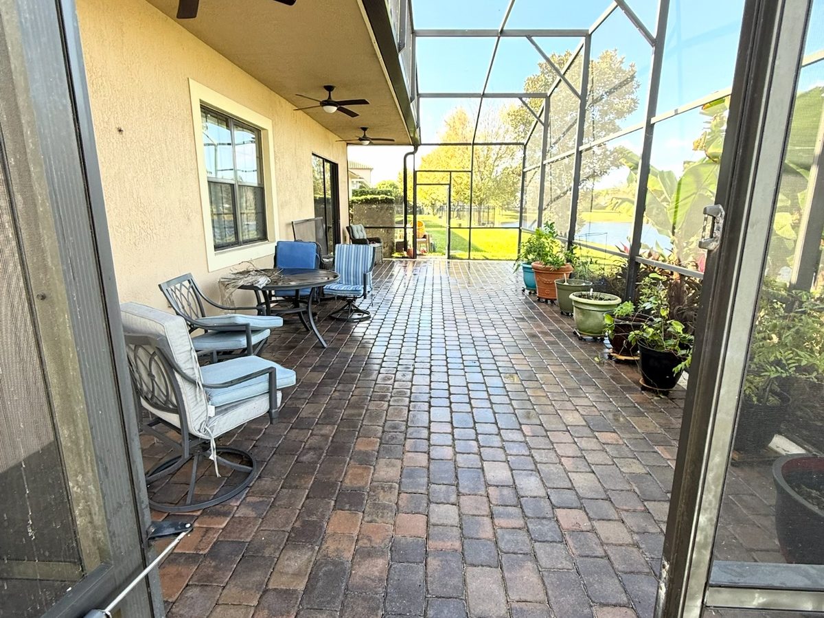 Paver patio freshly cleaned by ProShine Squad, still wet